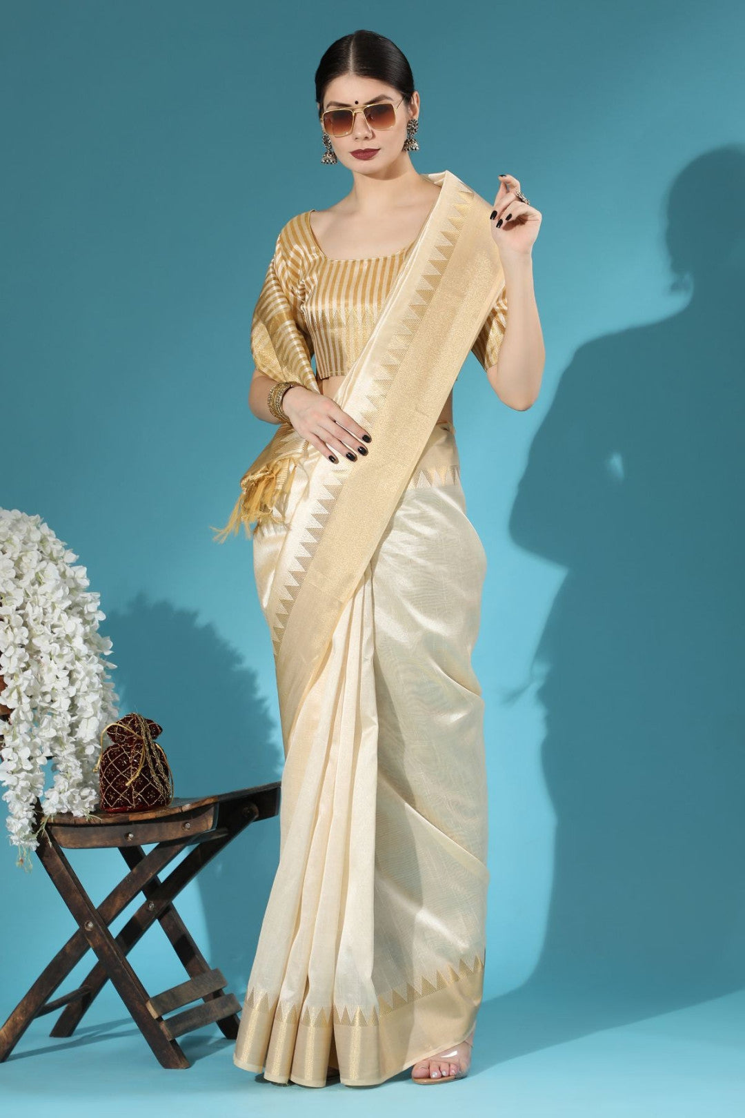 Off white aasam silk saree with zari weaving work